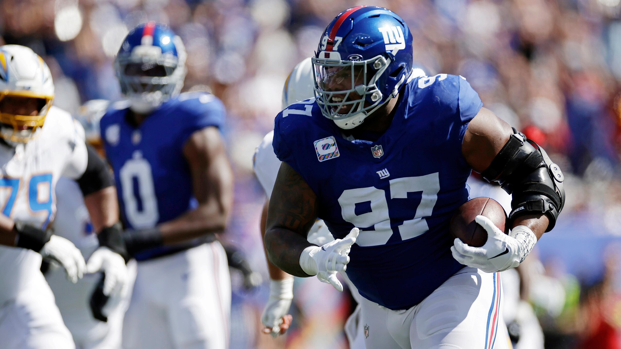 Giants Harbaugh's Program Begins Football
