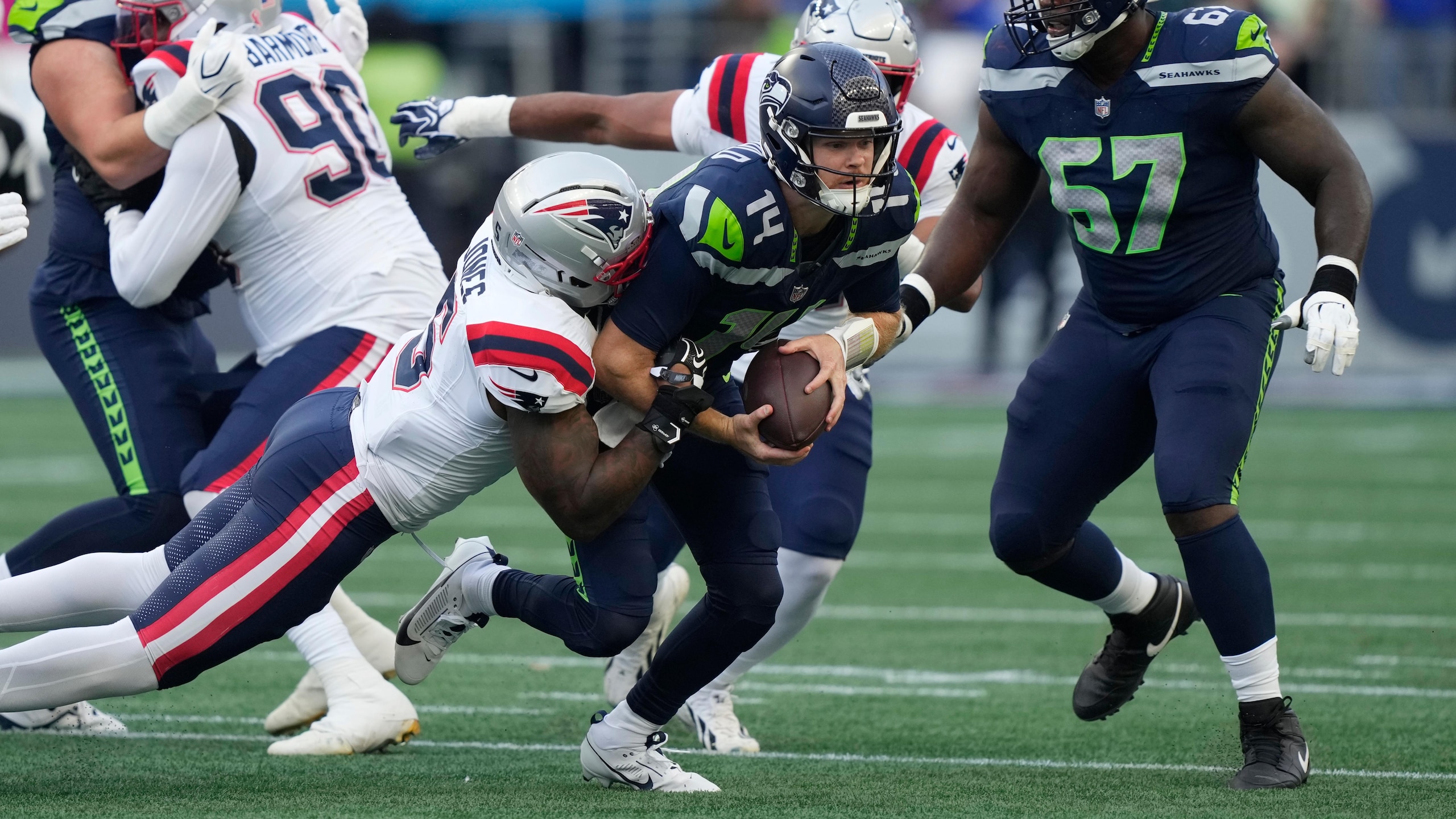 Photos of the NFL season opener, a rare Super Bowl rematch between the Seahawks and Patriots