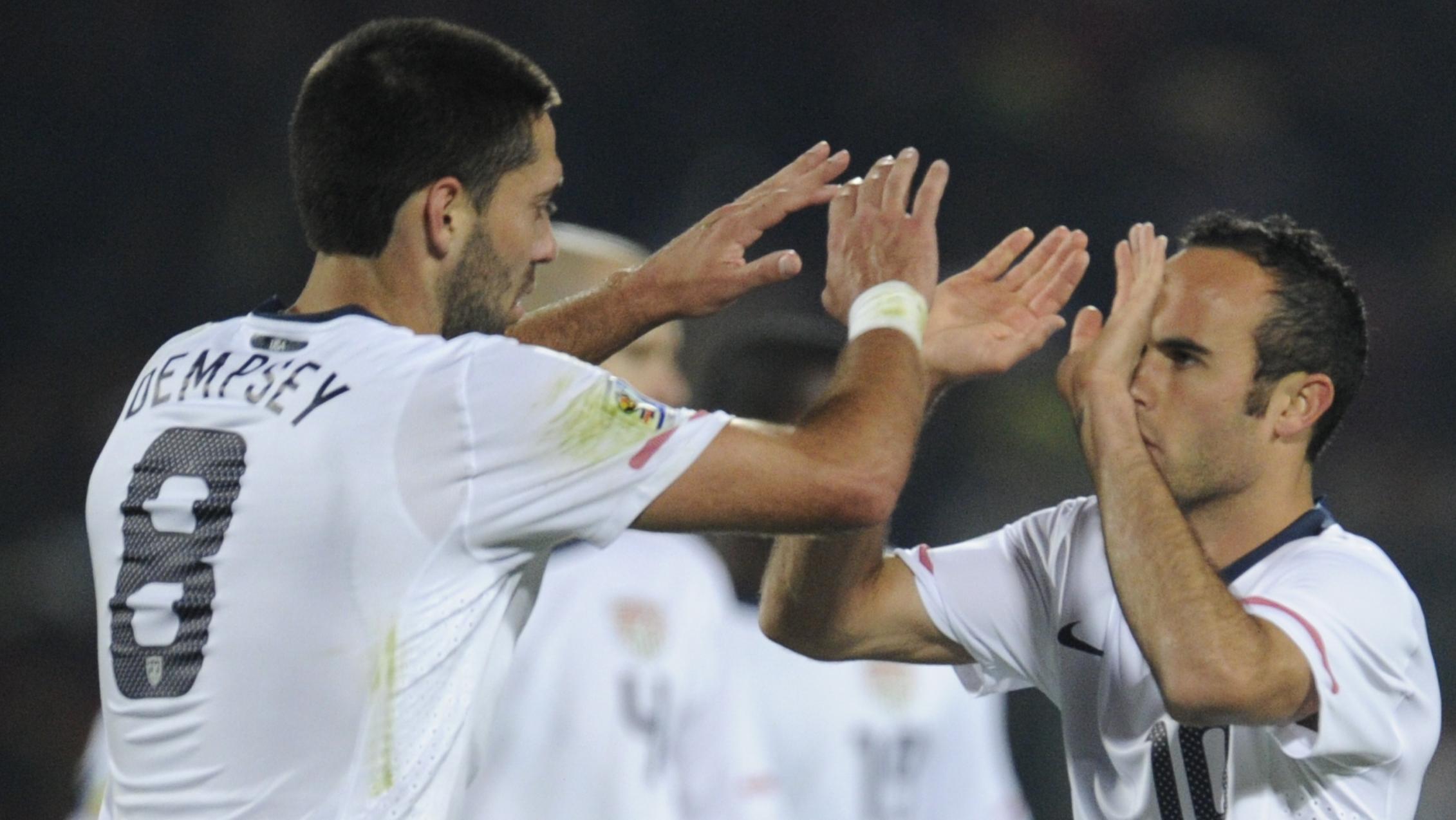 US midfielder Landon Donovan (R) celebra