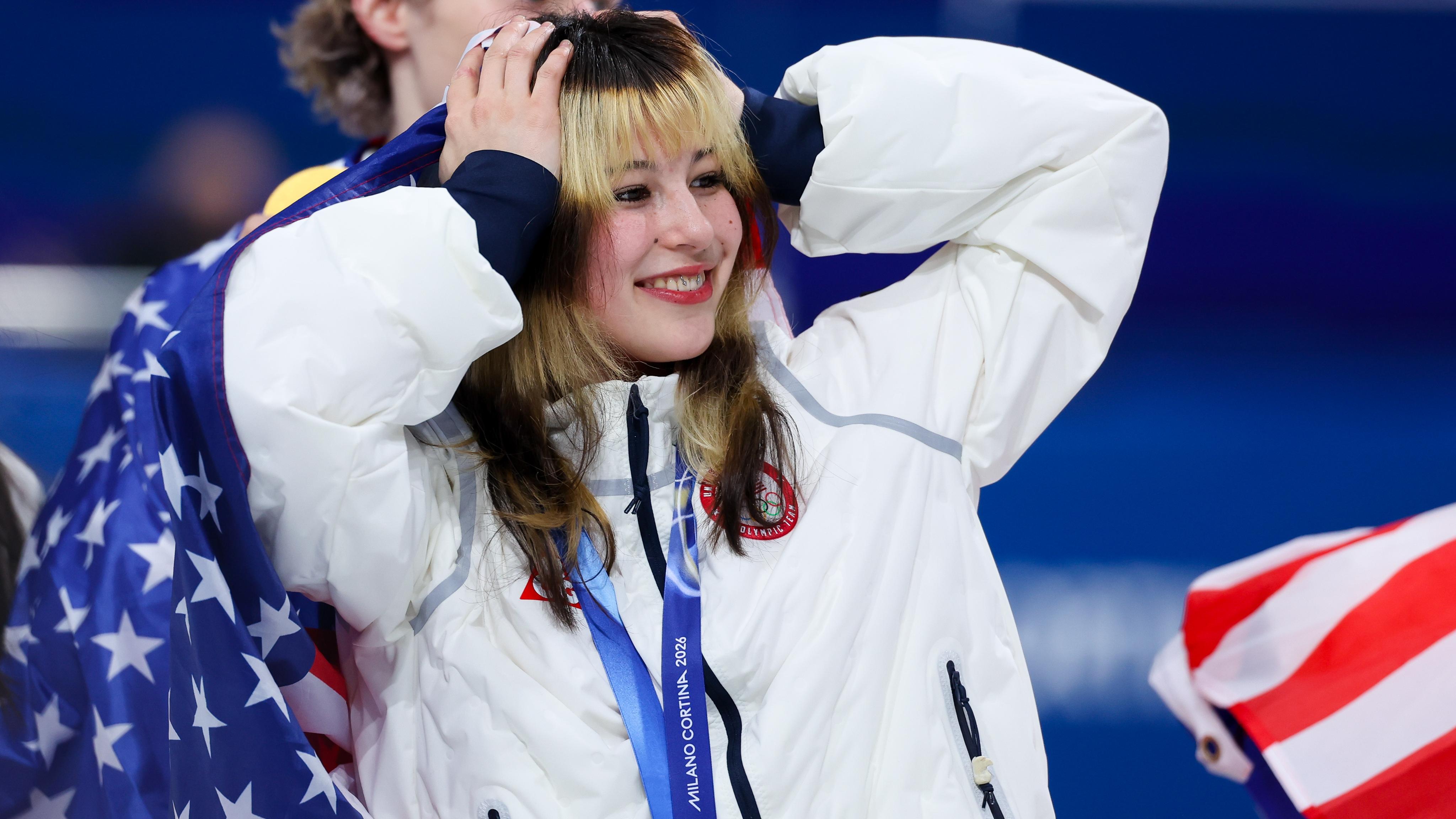 Gold medalist Alysa Liu of Team United States celebrate...