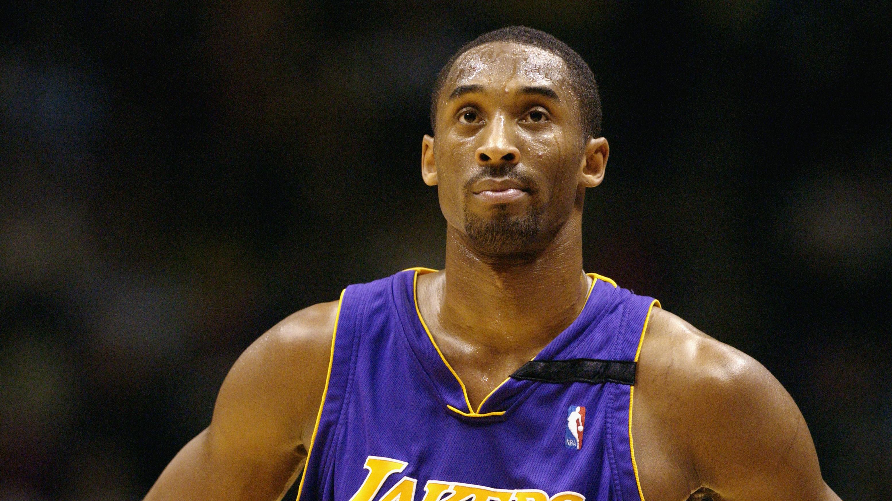 Kobe Bryant looks at the clock