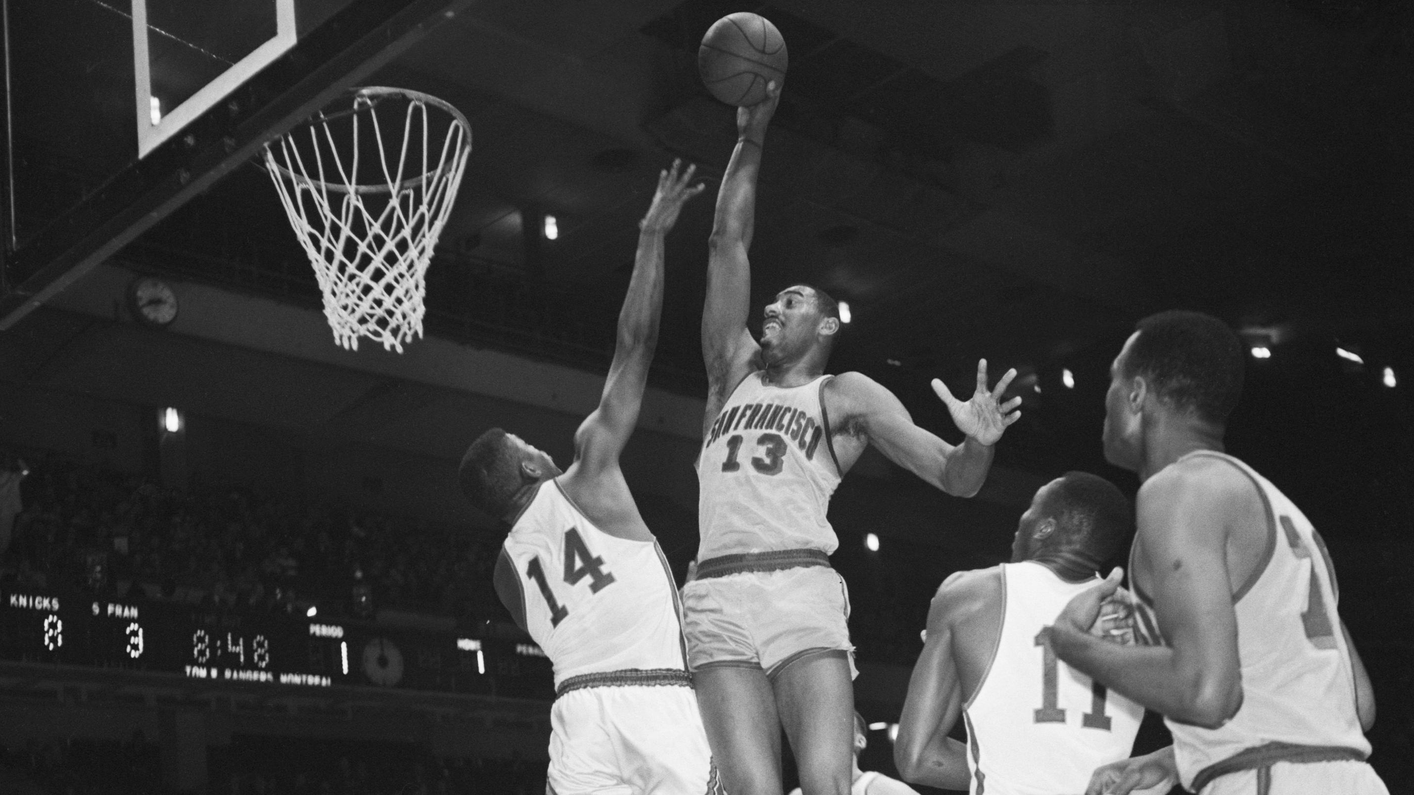 Wilt Chamberlain Shooting Over Defender