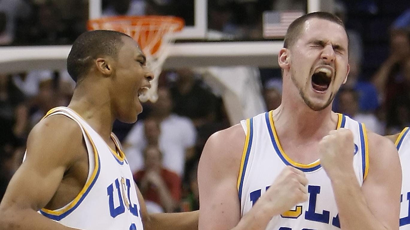 Teammates Russell Westbrook, left, and Josh Shipp, right, join in the celebration with Kevin Love a