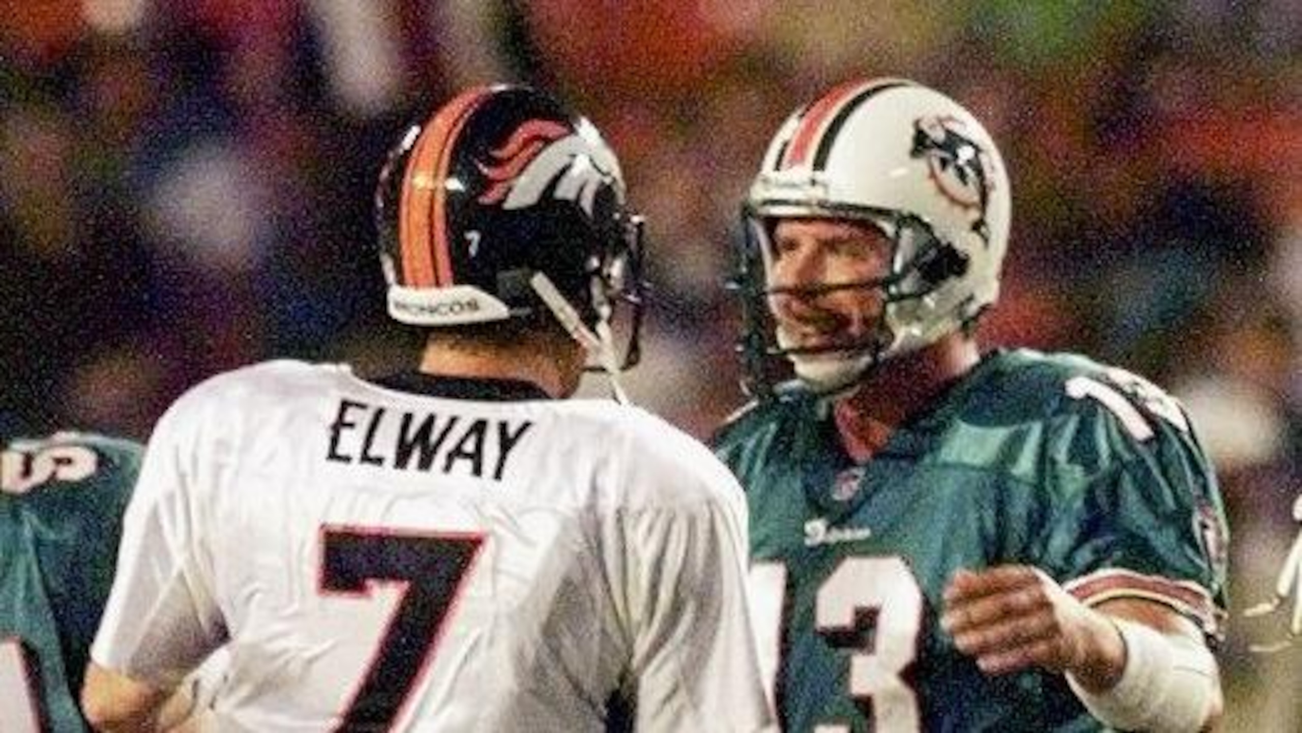 Denver Broncos quarterback John Elway (L) shakes h