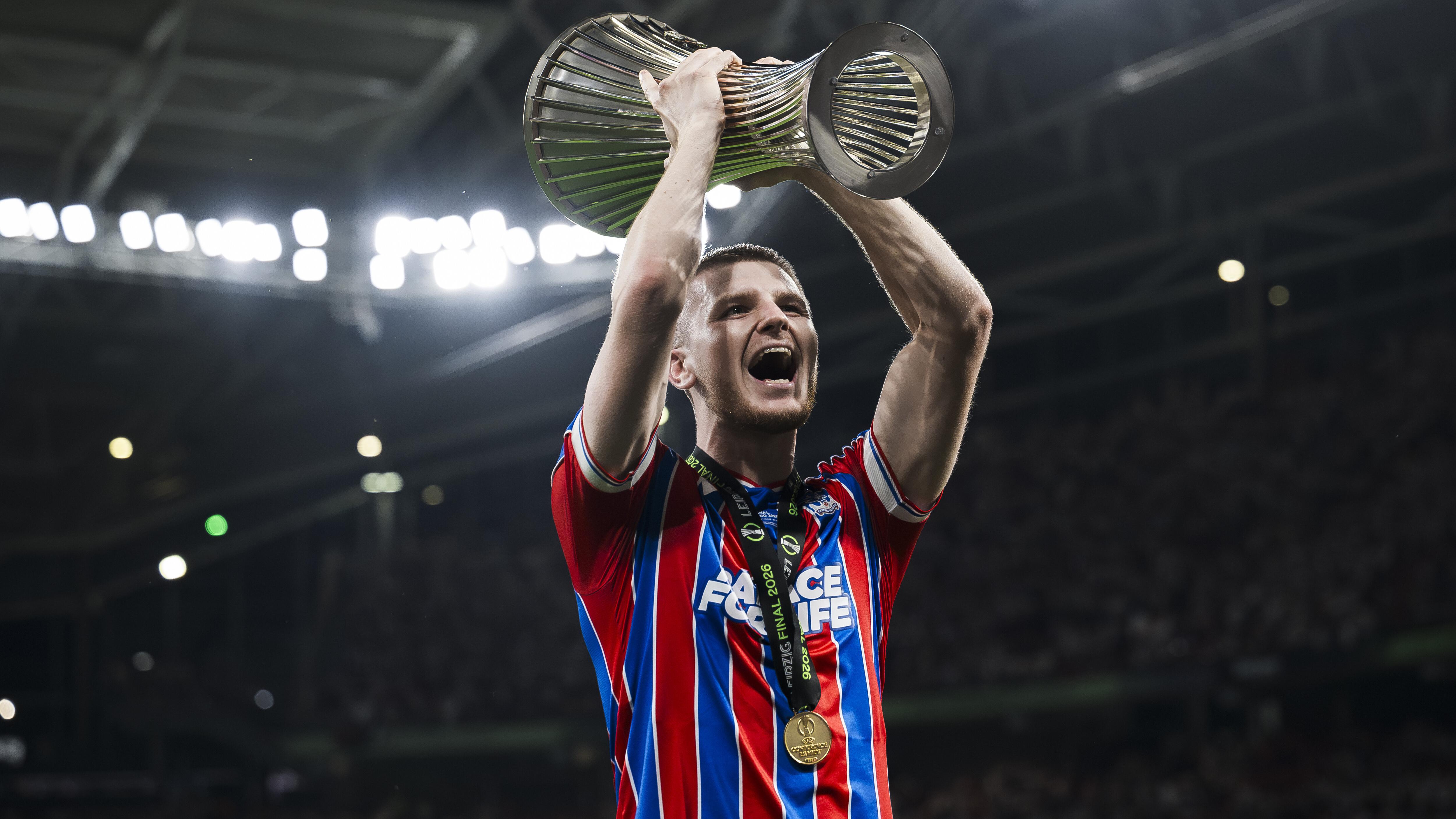 Adam Wharton of Crystal Palace FC lifts the trophy during