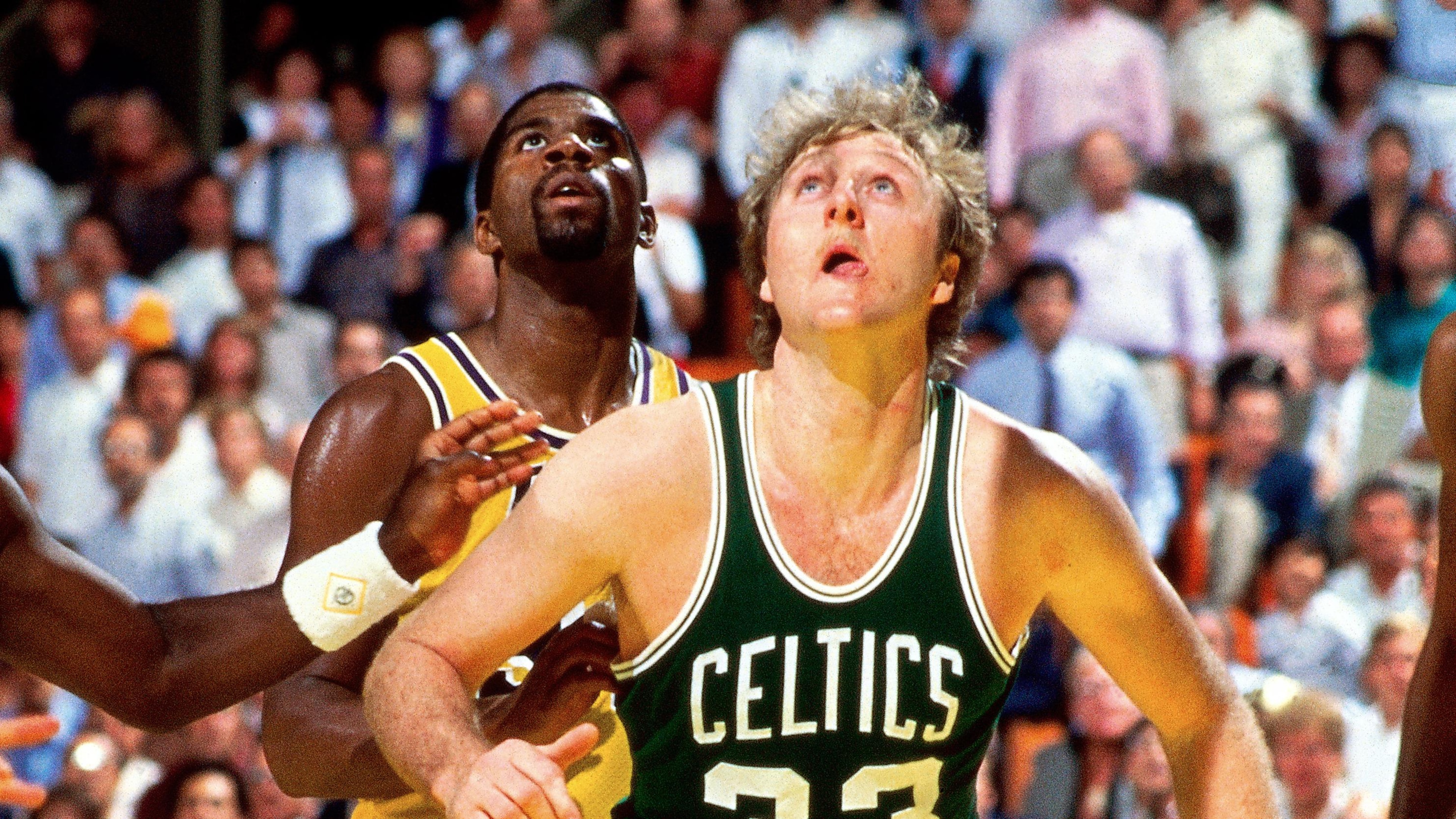 Larry Bird and Magic Johnson wait for the rebound
