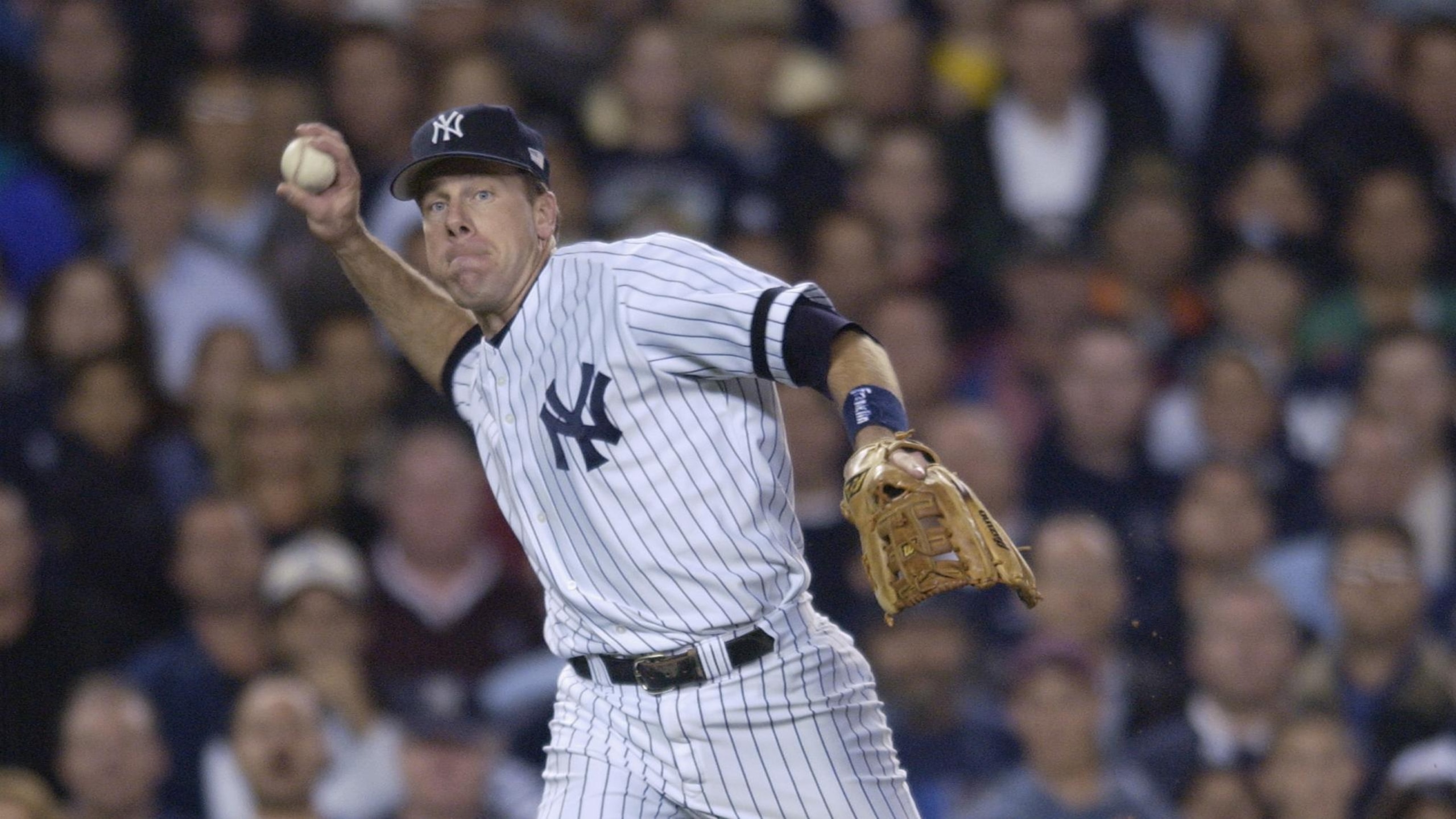 Brosius throws to first base
