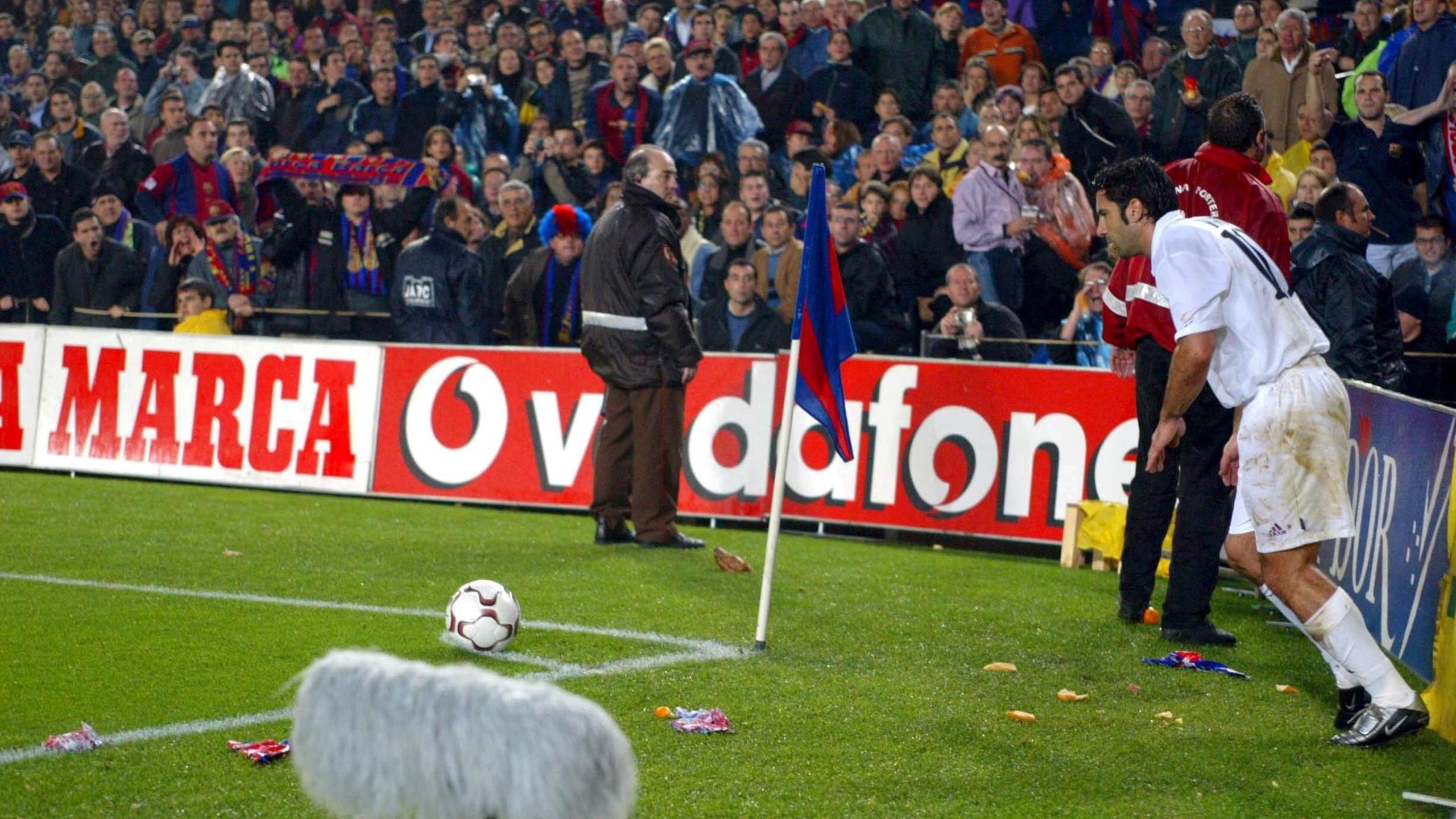 Luis Figo of Real Madrid is bombarded by missiles Luis Figo of Real Madrid is bombarded by missiles