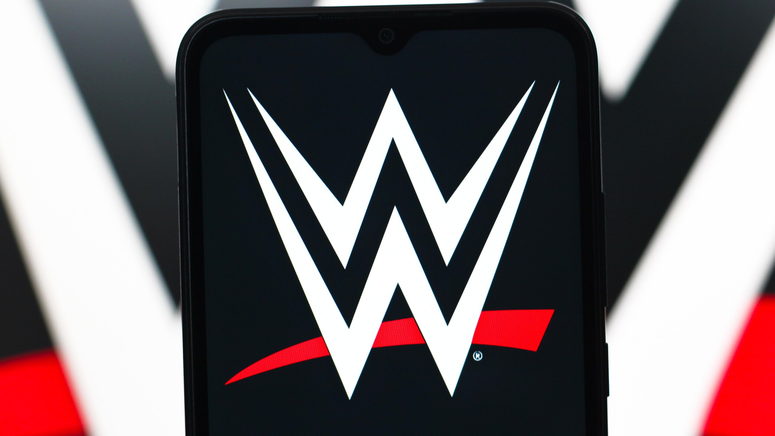 In this photo illustration, the WWE (World Wrestling...