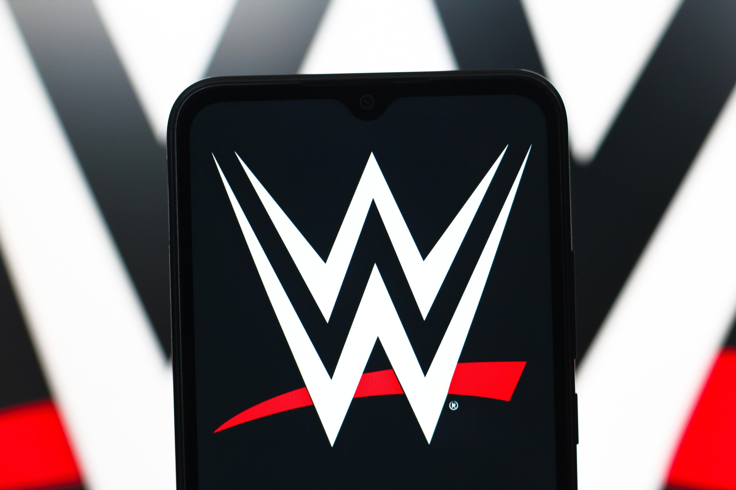 In this photo illustration, the WWE (World Wrestling...