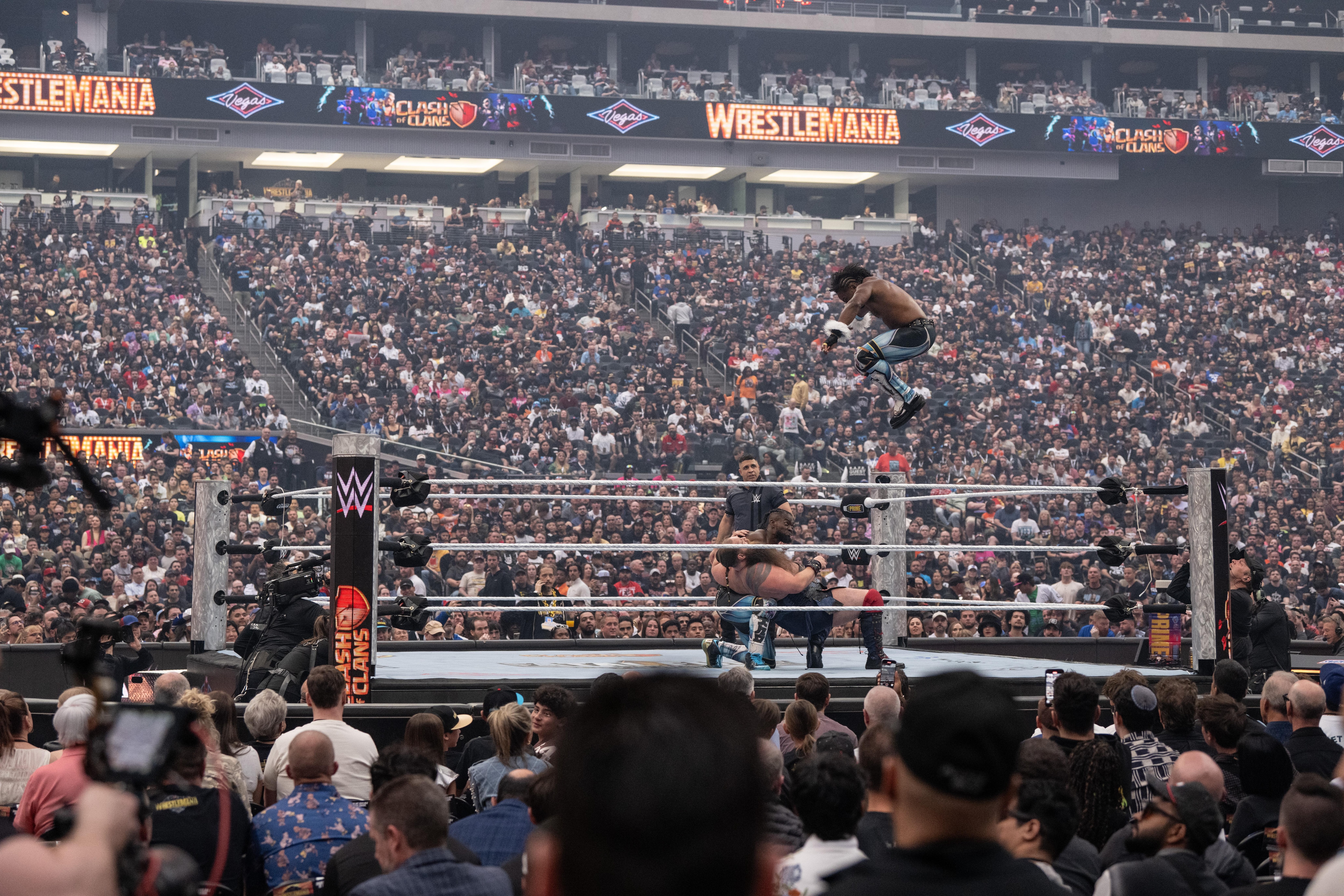 WWE wrestling match action professional wrestlers in ring competition athletic performance