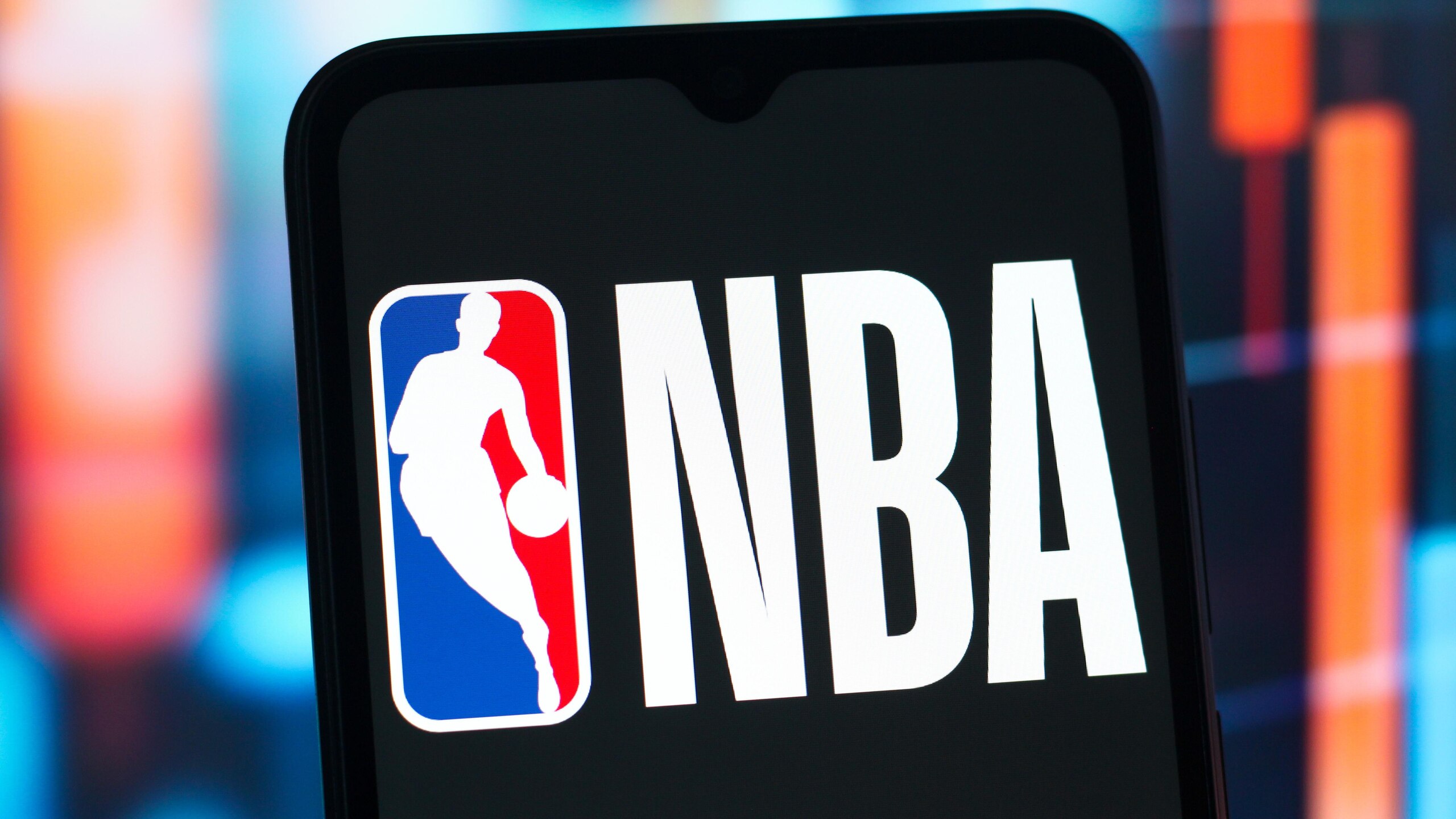 In this photo illustration, the NBA (National Basketball...
