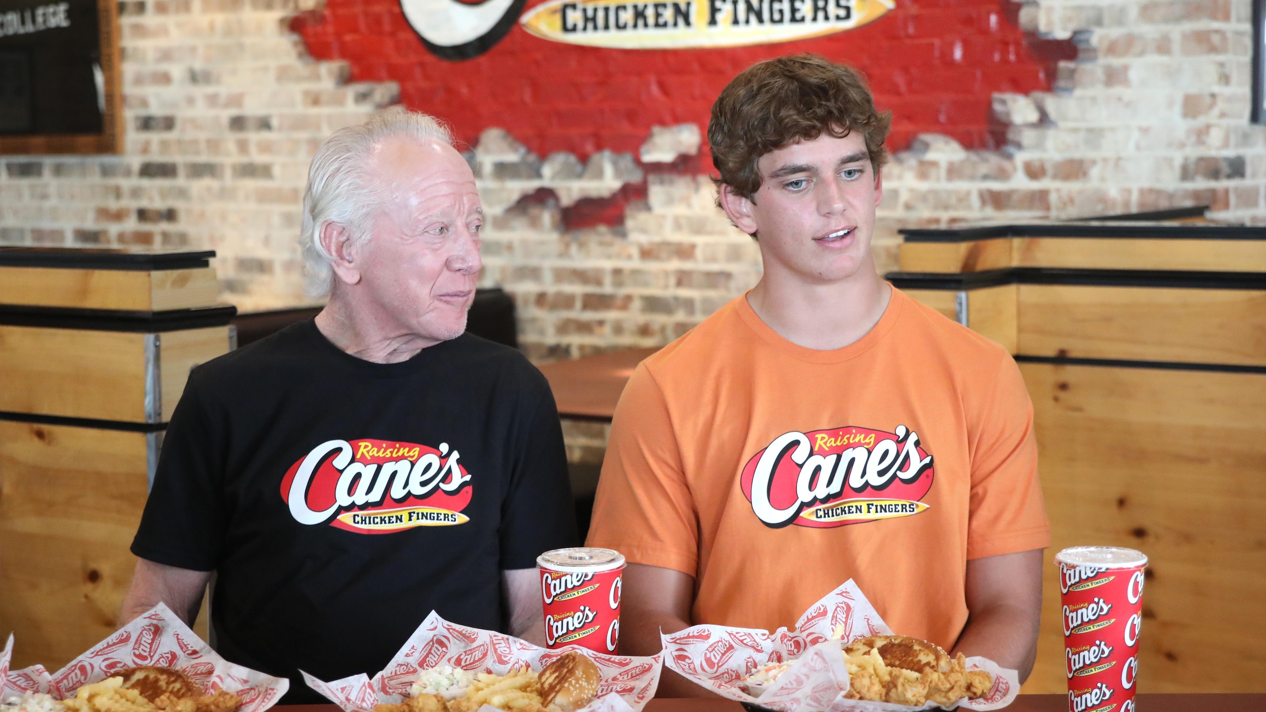 Arch, Cooper And Archie Manning Work A Pre-Manning Passing Academy "Shift" With LSU Quarterback Garrett Nussmeier At Raising Cane's Thibodeaux, Louisiana Arch, Cooper And Archie Manning Work A Pre-Manning Passing Academy "Shift" With LSU Quarterback Garrett Nussmeier At Raising Cane's Thibodeaux, Louisiana