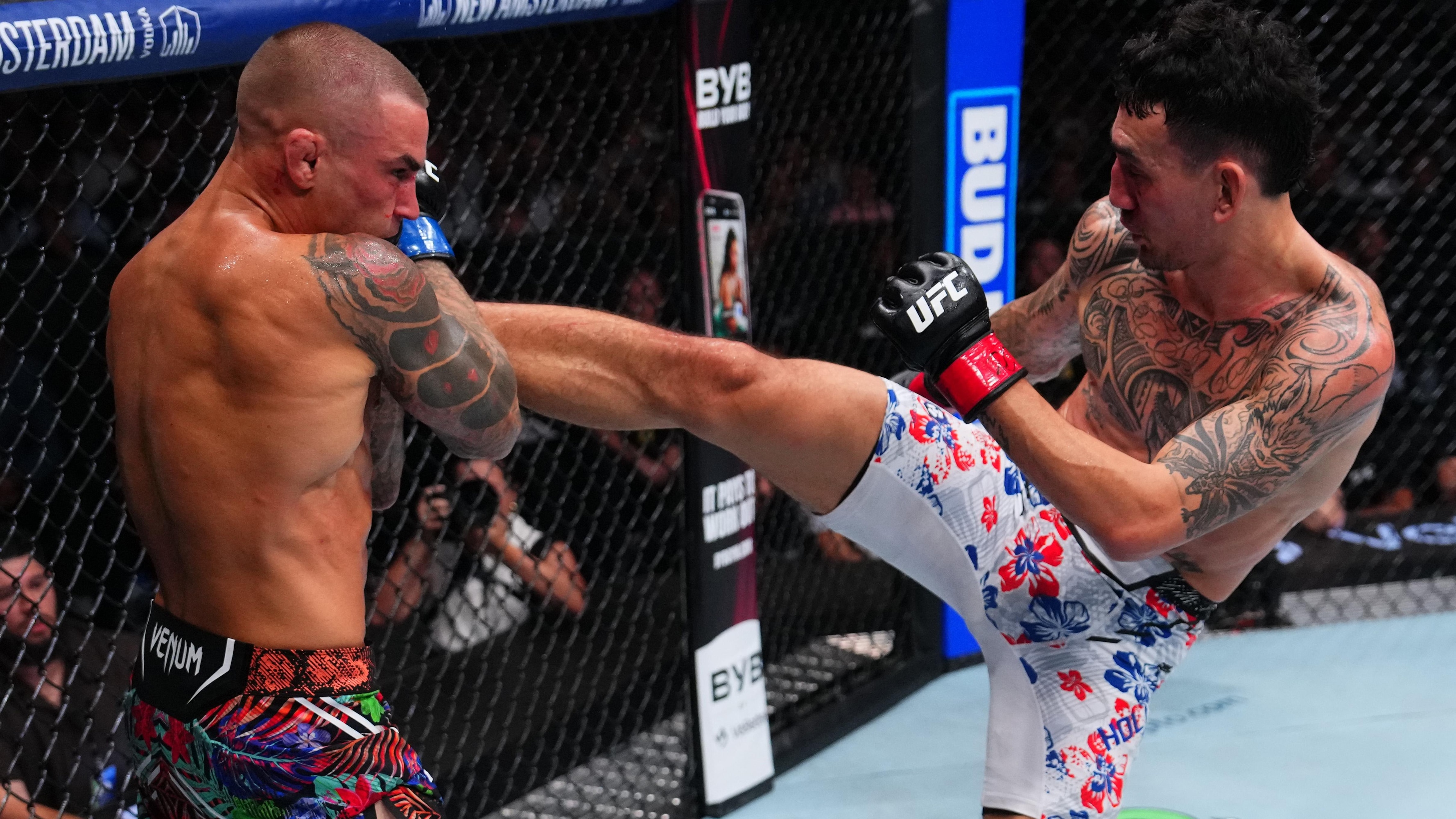 Dustin Poirier Loses Retirement Fight as Max Holloway Retains BMF Title at UFC 318