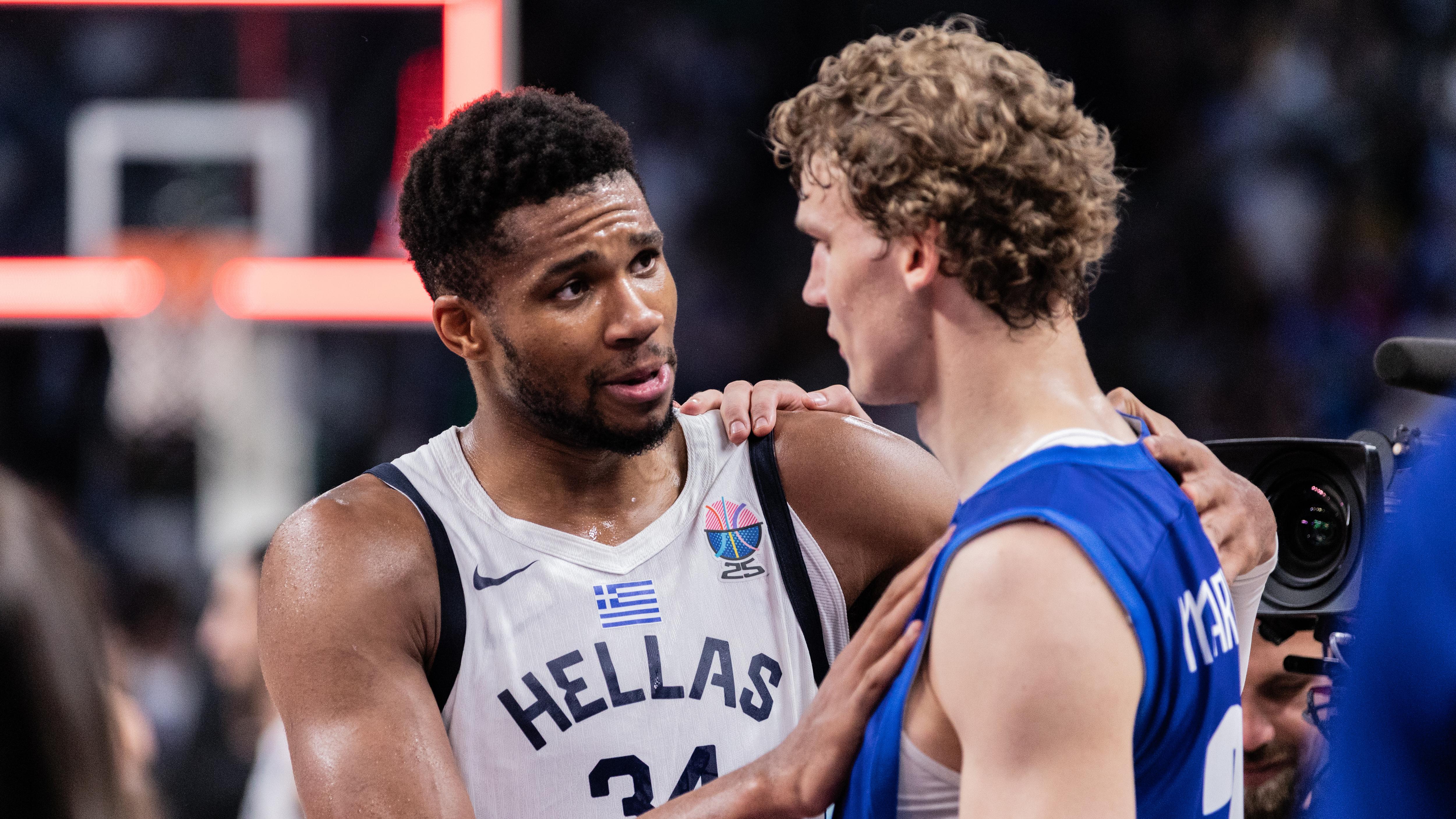Giannis Antetokounmpo of Greece (L) and Lauri Markkanen (R)...