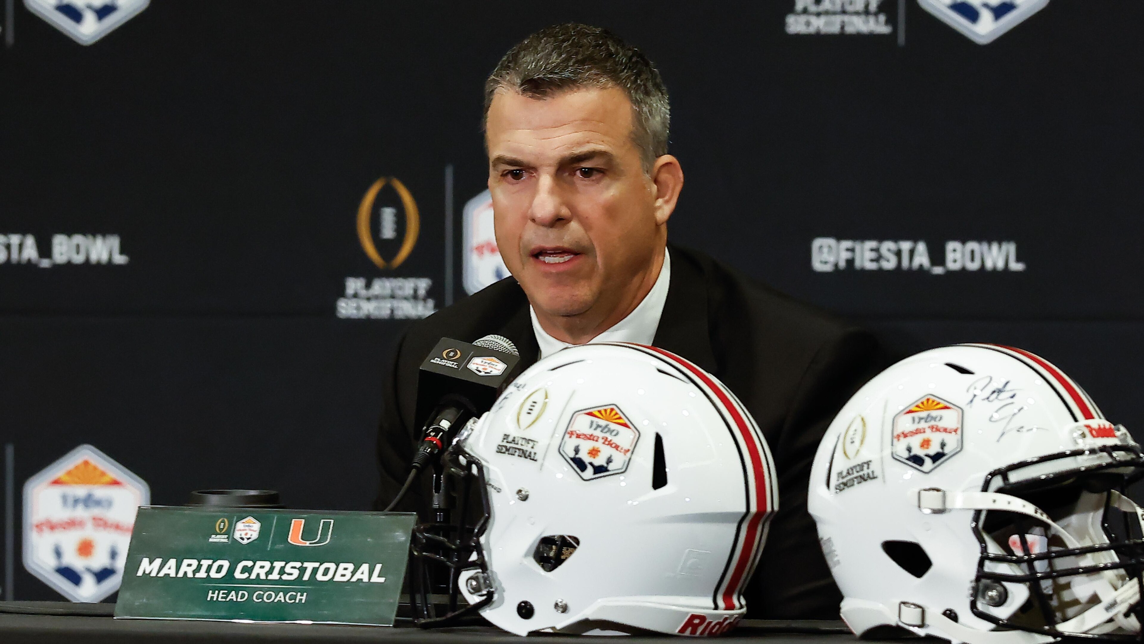 COLLEGE FOOTBALL: JAN 07 Coaches Press Conference for the College Football Playoff Semifinal at the Vrbo Fiesta Bowl Miami vs Ole Miss