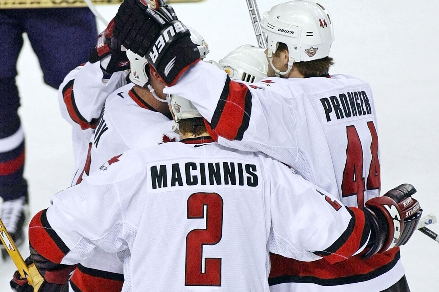 Canadian Al Macinnis (front) and Chris Pronger (R)