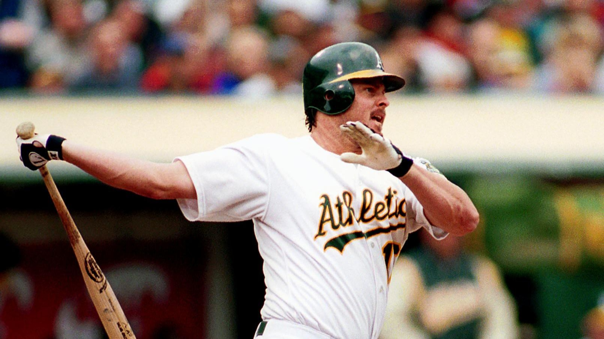 Oakland Athletics slugger Jason Giambi watches his