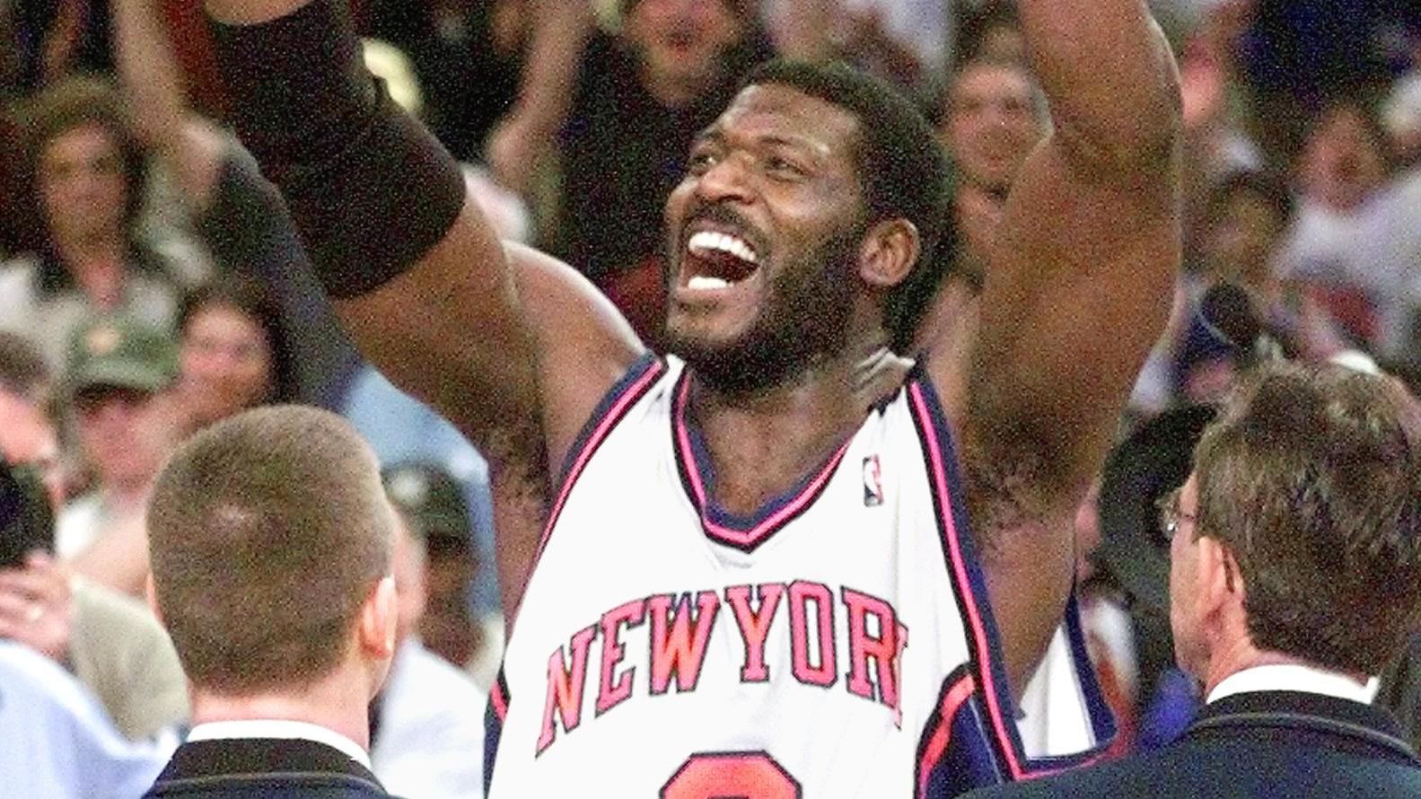 New York Knicks foward Larry Johnson celebrates wi
