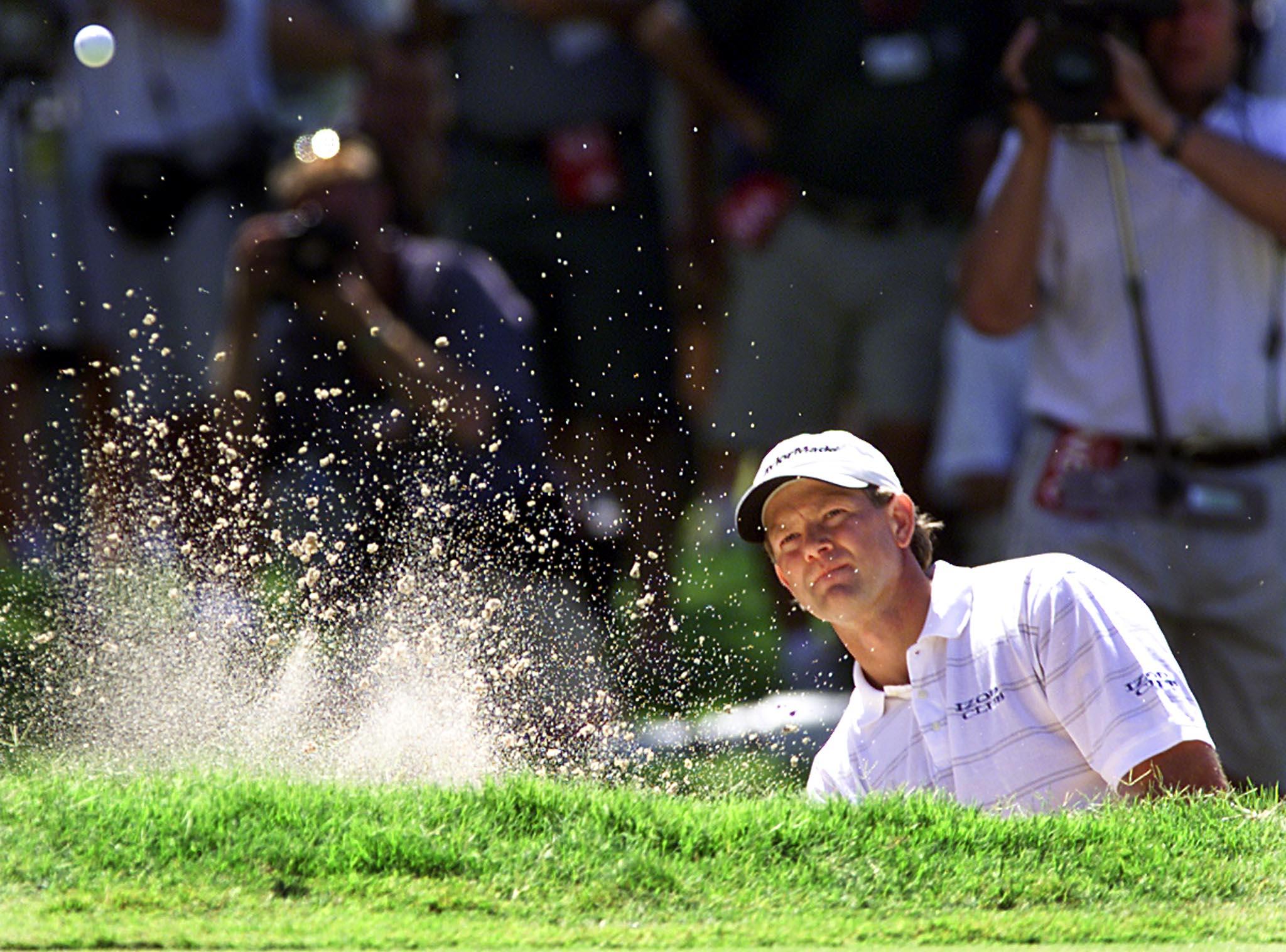 Retief Goosen of South Africa blasts out a bunker