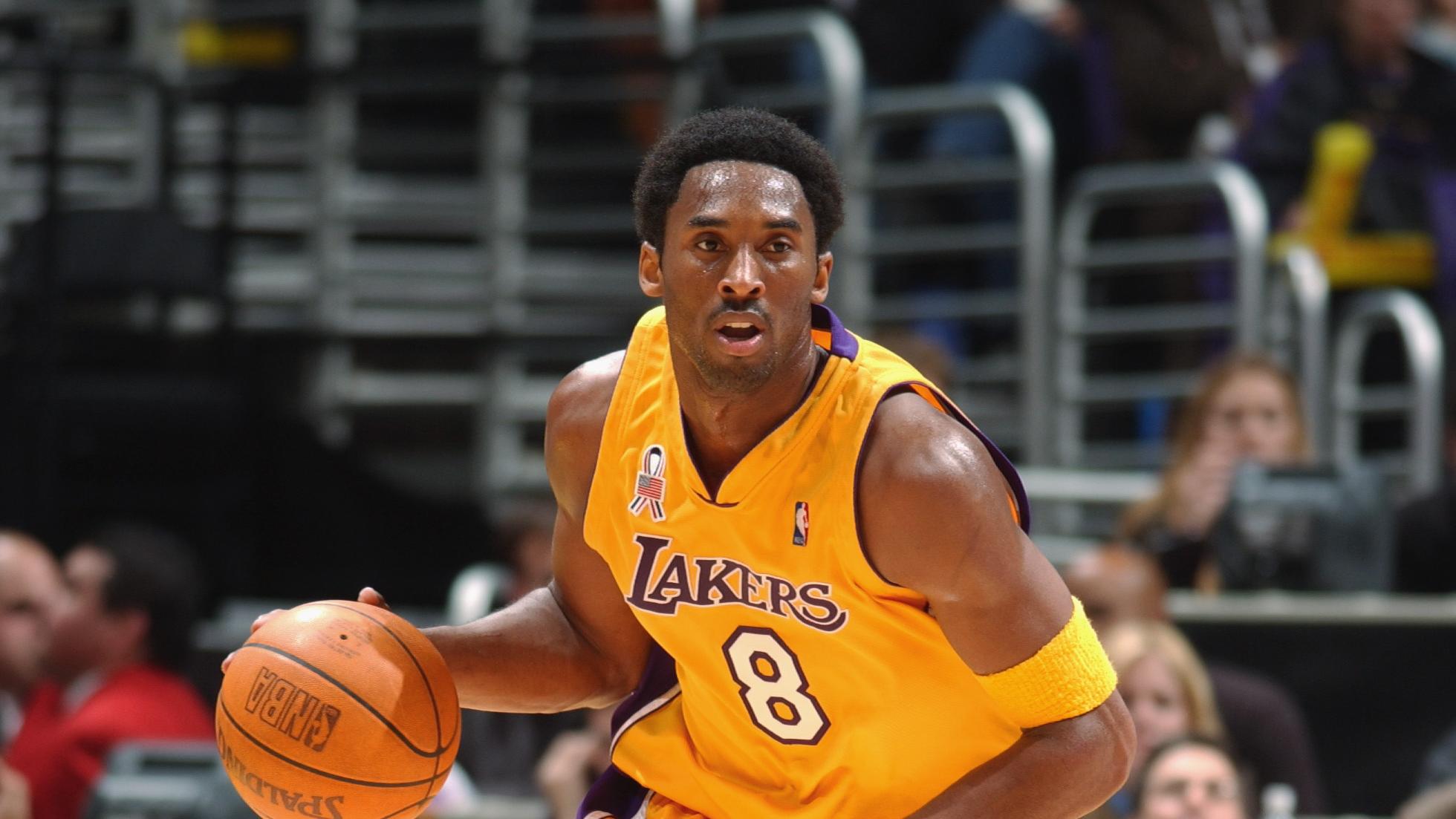 Kobe Bryant dribbles the ball