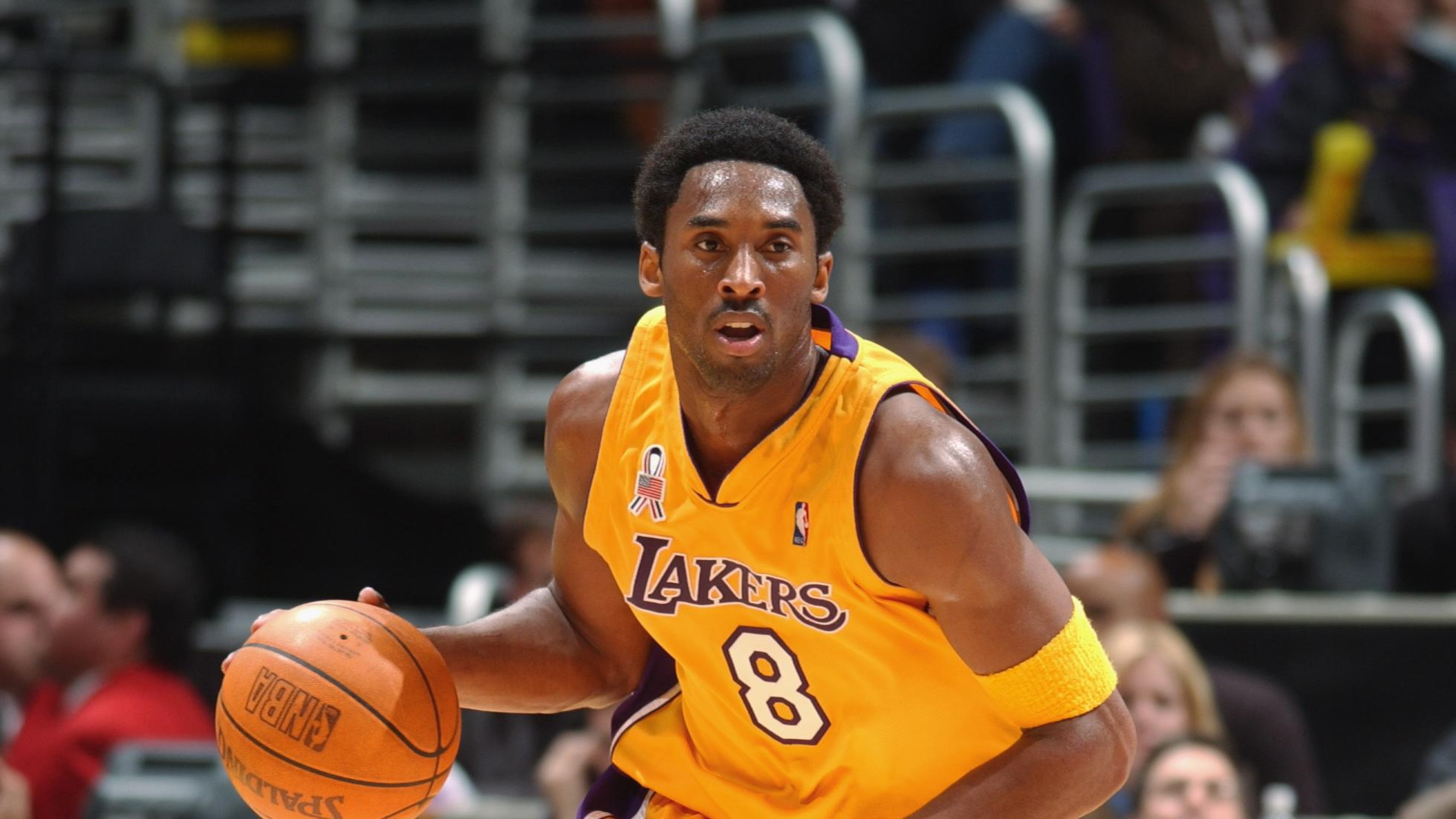 Kobe Bryant dribbles the ball