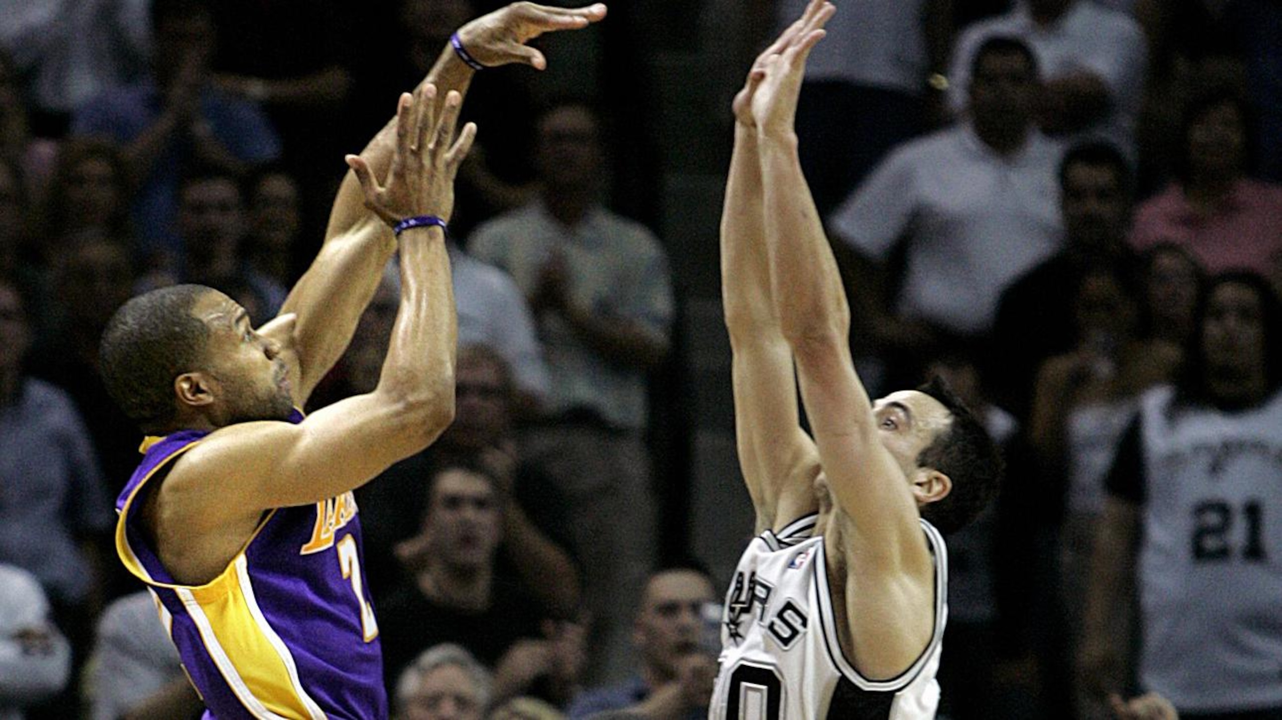 Lakers Derek Fisher shoots his game winning shot over Spurs Manu Ginobili points to the shot clock i